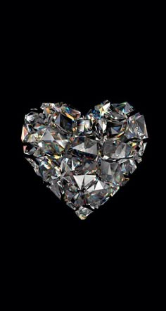 a heart shaped diamond on a black background