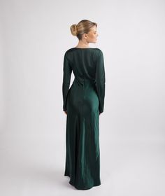 a woman in a long green dress