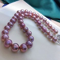 Stunning Edison Purple Pearls Beaded Necklace, 10-14mm, Rich Metallic Purple Color, Multicolored, Very High Luster.  Absolutely Eye Catching  Beauty!  Classic, Colorful and Stunning   Lustrous Beauty   Pearl ★ Pearl: Genuine Freshwater Edison Pearl ★ Size: 10-14mm ★ Shape: Near Round ★ Color: Natural untreated, Beautiful Metallic Purple Colors, Multicolored, Stunning ★ Luster: Wonderful, Very High Luster ★ Surface: Nice, Baby Smooth and Mirror Like, lightly spotted, gentle texture, Mostly Clean Luxury Purple Pearl Necklaces, Nice Baby, Edison Pearls, Purple Pearl, Pearl Choker, Pearl Size, Pearl Beads, Beaded Necklaces, Purple Color