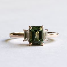 Emerald Gemstone Engagement Ring Gold, Tourmaline And Diamond Ring, Engagement Rings Emerald Cut Three Stone, Wedding Ring With Emerald Accents, Vintage Green Wedding Ring, Green Gem Rings, Green Emerald Cut Engagement Ring, Emerald Cut Gemstone Ring, Green And Gold Engagement Ring