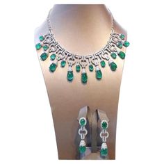 An exceptional Art Deco style parure, complete with earrings and necklace, so stunning and refined , a very piece of art. Necklace come in 18k gold with natural emeralds from Zambia, extra fine quality, in cabochon cut , Ceo Minor, of 91,85 carats, and 640 pieces of natural diamonds of 8,52 carats, F color and VS clarity. Earrings come in 18k gold with 4 pieces of natural emeralds from Zambia, extra fine quality ,Ceo Minor , of 26,76 carats, and 140 pieces of natural diamonds of 1,96 carats, rou Exquisite 17 Jewels Jewelry For Evening, Luxury Emerald Jewelry For Formal Occasions, Exquisite Diamond And Emerald Formal Necklace, Exquisite Diamond Emerald Necklace For Formal Occasions, Exquisite Emerald Necklace With Diamonds For Formal Events, Formal White Gold Emerald Necklace, Exquisite Hand-set Emerald Necklace For Formal Occasions, Classic Emerald Jewelry For Evening, Formal Emerald Necklace With Diamond Cut