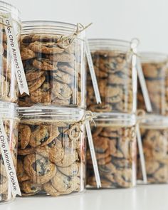 several jars filled with cookies sitting on top of a table