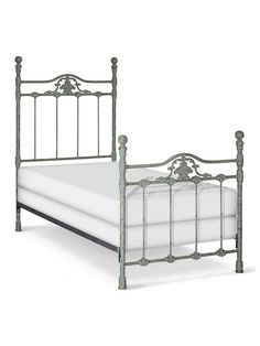 a metal bed frame with white sheets and pillows on it's headboard, against a white background