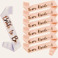 the bride and groom name tags are on top of each other, with ribbons attached to them