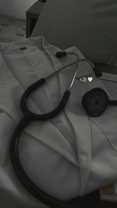 a stethoscope laying on top of a bed