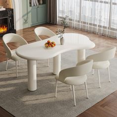 a white table with four chairs around it in front of a fire place and fireplace