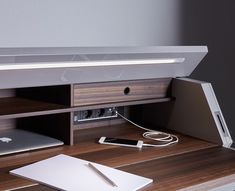 an apple laptop computer sitting on top of a wooden desk