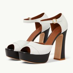 Step into style with these White and Black Peep Toe Chunky Heel Platform Sandals. Featuring a chic contrast design, comfortable platform, and chunky heels, these sandals are both trendy and versatile. Color: Black and white Heel Type: Chunky heel Heel height: 5.11" / 130 mm approx Product measurements were taken using size 8. Please note that measurements may vary by size. Toe: Peep toe With platform Adjustable buckled ankle strap design Handcrafted US sizing. Fits true to size.