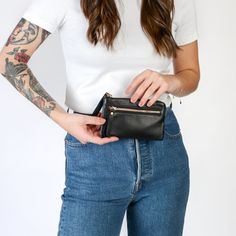 If you like to keep things simple and easy, the Minimalist Wallet is the all-in-one solution for you! The perfect size with a built-in wallet, you won't ever want to swap out your wallet again!Handcrafted in full-grain leather with solid brass hardware and comes with a build-in 5 card wallet and outside zipper pocket for small items. Complete with zipper closure.Ways To Wear Fits into all TAH Bags Use as a wallet with built-in 5 card pockets Inside pocket fits small iPhone Details Built-in 5 car Versatile Leather Wallet With Hidden Phone Sleeve, Modern Wallets With Cell Phone Pocket For Everyday Use, Modern Wallet With Cell Phone Pocket For Everyday Use, Versatile Wallets With Card Slots For Everyday Carry, Versatile Leather Card Holder, Versatile Wallets With Hidden Phone Sleeve For On-the-go, Versatile Leather Wallet With Cell Phone Pocket, Modern Trifold Wallet For Everyday Use, Modern Trifold Wallet With Card Slots