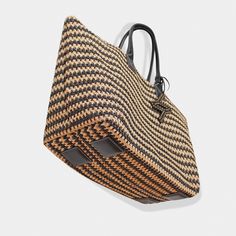 The ultimate in beachside luxury with the Bianca Tote, crafted for your stylish escapes to Capri, st. Tropez, and other exciting destinations.Be the trendsetter with this must-have tote. Raphia crochet Nappa soft calfskin Top handle, 9.5'' (24,1 cm) drop Height: 13'' (33cm) Width: 17,7'' (45cm) Depth: 9,8'' (25cm) Gold hardware Detachable raphia crochet & leather pouch (Height: 8'' (20cm) Width: 10.7'' (27cm)) Canvas lining 100% Made in Italy. Cleaning and Care Our handbags are made of the highe Luxury Summer Straw Bag With Open Weave, Luxury Open Weave Straw Bag For Summer, Luxury Natural Crochet Bag With Intrecciato Weave, Luxury Open Weave Beach Bag, Luxury Crochet Tote Bag With Intrecciato Weave, Luxury Handwoven Crochet Bag For Shopping, Luxury Natural Woven Crochet Bag, Luxury Handwoven Crochet Travel Bag, Luxury Summer Straw Bag For Beach