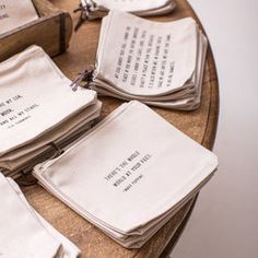 several napkins are stacked on top of each other and placed on a table with writing