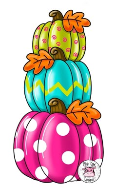 a stack of colorful pumpkins sitting on top of each other