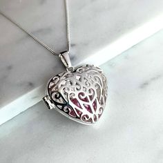 ...This is your perfect gift! Sterling Silver Filigree Heart Locket Pendent with beautiful Heart shaped floating Pink Crystal hidden inside as a surprise ...hanging on a gorgeous 18 inch Italian Curb chain. Name Necklace Description: Sterling Silver 925 SOLID - not Plated like most others are - Style: Locket Stone: Crystal simulated Heart shape Chain Type: Curb Chain in Solid Sterling Silver Length: 18 Inches weight: 7.6g BRAND NEW and the perfect gift for Mothers Day, your wife, girlfriend, loved one or a just a treat for yourself.  USA's company Please don't hesitate to contact us if you have any questions regarding this item. Sterling Silver Round Pendant Locket For Valentine's Day, Silver Sterling Silver Locket Necklace For Valentine's Day, Valentine's Day Sterling Silver Round Pendant Locket Necklace, Valentine's Day Silver Sterling Silver Locket Necklace, Valentine's Day Sterling Silver Round Locket Necklace, Valentine's Day Silver Sterling Locket Necklace, Valentine's Day Sterling Silver Round Pendant Locket, Valentine's Day Sterling Silver Locket Necklace, Silver Locket Necklace Pendant For Valentine's Day