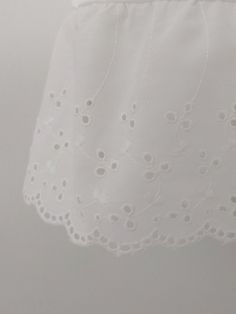 "An exquisite accessory for your wardrobe, this feminine underskirt slip worn with your skirt or dress will make you feel very special ! It is made of white nylon with elastic waistband and 5 inches white cotton scalloped eyelet ruffle trim. Standard length is 25\" This accessory makes a perfect gift! Hand wash in cold water. Available in sizes: XS-0-2, Waist: 24 1/2\", Hip: 35\" S-4-6, Waist: 25 1/2\"-26 1/2\", Hip: 36-37\" M-8-10, Waist: 27 1/2-28 1/2\", Hip: 38-39\" L-12-14, Waist: 30-31 1/2\ White Skirted Dress For Daywear, White Tiered Skirt Petticoat For Summer, Elegant Cotton Petticoat For Summer, Elegant Summer Petticoat With Lace Trim, Spring Stretch White Petticoat, White Petticoat For Daywear In Spring, White Pleated Skirt For Daywear, Elegant Summer Petticoat Skirt, Delicate White Dress For Daywear