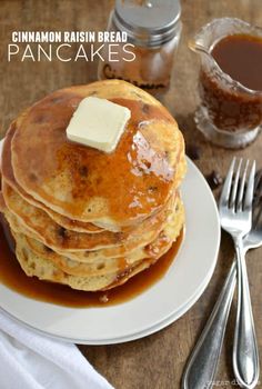 a stack of pancakes covered in syrup and butter