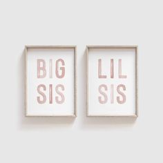 two framed art pieces with the words big sis and little sis in pink on them