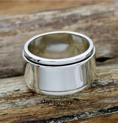 Welcome To My Shop  Handmade item Materials: Silver Band color: Silver Style: Boho & hippie Hammered wide-band spinner fidget silver ring for women. Made of solid sterling silver. Perfect as a gift for a loved one. ❥ Metal: Solid sterling silver ❥ US Ring Size: Choose Size ❥ Ring Width: 13mm This is a wide ring. We recommend choosing a half or a full size up than your regular size for best fit. ✈ Free Shipping (USPS) 🎁 Free Gift Box ↻ 60 Days Return ⌛ 24 Handling Time Thanks & Regards Mystic Topaz Ring, Plain Rings, Silver Ring For Women, Meditation Ring, Chunky Ring, Meditation Rings, Silver Spinner Rings, Thumb Ring, Chunky Rings