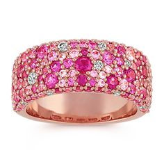 Crafted in quality 14 karat rose gold, 121 round pink sapphires in various shades of pink (approx. 2.56 carats TW) and 16 brilliant round diamonds (approx. .17 carat TW) create this gorgeous cluster fashion ring. The total gem weight is approximately 2.73 carats and is 8.8mm wide. Luxury Pink Multi-stone Sapphire Ring, Luxury Pink Multi-stone Ruby Ring, Luxury Pink Ruby Ring With Rose Cut Diamonds, Pink Diamond Rings With Pave Setting, Pink Multi-stone Sapphire Diamond Ring, Pink Multi-stone Sapphire Ring With Diamond, Pink Sapphire Multi-stone Ring With Diamond, Pink Multi-stone Sapphire Ring In Fine Jewelry Style, Pink Multi-stone Sapphire Ring, Fine Jewelry