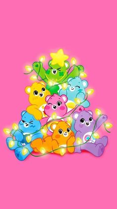 a bunch of teddy bears that are on a pink background with lights in the shape of stars