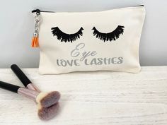 "Eye Love Cosmetic Bag Ladies, it's time to Lash Out!  This adorable Eye Love Cosmetic bag has plenty of room for all of your lash essentials and more.  The bag is a good size for everyday cosmetic use, a great size for traveling, or just toss it in your purse so you always have your makeup and lashes with you on the go. The bag is a cotton canvas material with an embroidered eyelash design on the front and blank on the back.  The material is soft and feels great to the touch. The bag is pink or Lash Essentials, Eyelash Design, Eyelash Makeup, Zipper Makeup, Bag With Tassel, Bag Makeup, Makeup Eyelashes, Pink Eyes, Lashes Makeup