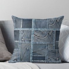 a denim patchwork pillow on a couch