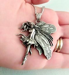 ★ Fairy Pendant ★ A beautiful handcrafted Fairy Pendant for Men and Women. * Materials/Finishes ➤ Artificially Aged (Black/Grey Oxidized) Silver 925 * Dimensions ➤ 5.1 x 4.2 x 0.7 cm (~ 2.0 x 1.6 x 0.3 inches)/Suitable for up to 3.0 mm (~ 0.1 inches) Chain * Weight: ~ 17 grams ----------------------------------------------------------------------------- IMPORTANT NOTES: ----------------------------------------------------------------------------- ➤ When buying from Gold and Silver Designs you wi Sterling Silver Fairycore Jewelry, Fairycore Sterling Silver Jewelry, Fairycore Sterling Silver Jewelry In Silver, Fairy Style Sterling Silver Jewelry, Handmade Silver Fairycore Jewelry, Fairycore Sterling Silver Jewelry Gift, Fairycore Sterling Silver Jewelry For Gifts, Fairy Style Silver Jewelry For Gift, Handmade Fairy Grunge Jewelry