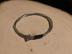 Bracelet made from recycled guitar strings for the music lover or guitar player in your life    Very unique gift for this holiday season! Guitar Pic Bracelet, Guitar String Jewelry, String Jewelry, Guitar Pics, Bangles Style, Bracelet Style, Guitar Strings, Guitar Player, Music Lover