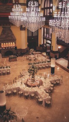 an overhead view of a banquet hall with chandeliers and tables