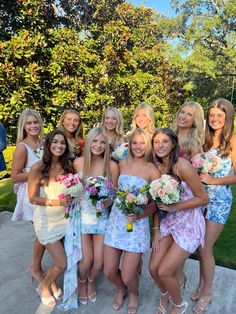 a group of young women standing next to each other