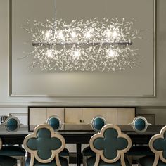 a chandelier hanging over a dining room table