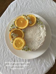 an orange poppy seed cake with ginger cinnamon butter frosting on a white platter