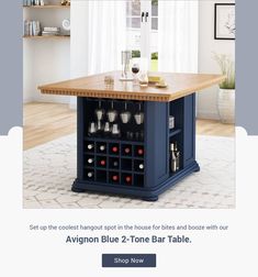 a blue kitchen island with wine glasses on it