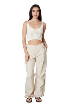 The parachute pant trend is not over yet! The Ludlow Parachute Pant in tan is the trendiest pant for any occasion! Featuring a drawstring waist, and cargo inspired pockets, these mid-rise pants are the perfect mix of comfortable and cute! Pair with the Quinn Croc Slide Heel for a classy look! Parachute Pant, Pants Gift, Trendy Pants, Pant Trends, Elevated Basics, Hoodie Fits, Swim Fashion, How To Look Classy, Drawstring Waistband