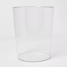 a clear glass is sitting on a white surface