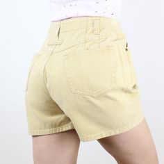 Item Description  These are so fun and unique! I love this brand, and the high rise and baggy-fit style is so fun and so classic early 90s! These are in a soft yellow color and are made of a 100% cotton rigid denim! They have belt loops that are set a bit lower than the waistband, front and back pockets, and a unique pleat design, where some of the pleats are actually in the pockets! These are meant to have a fun curvy/baggy fit (not at all slim) so definitely take a look at the measurements to Summer High-waisted Jean Shorts With Belt Loops, Trendy Cotton High-waisted Jean Shorts, Y2k High-waisted Shorts, Jean Shorts With Belt Loops For Summer, Y2k Jean Shorts With Built-in Shorts For Summer, Y2k Jean Shorts For Summer, Y2k Style Jean Shorts For Summer, Y2k Style Short Jean Shorts For Summer, Trendy Summer Bottoms With Belt Loops