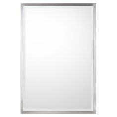 a white framed mirror on a wall