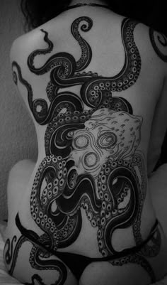 a woman with an octopus tattoo on her back