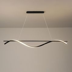 a modern light fixture hanging from the ceiling