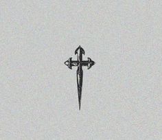 a black and white photo of a cross in the sky