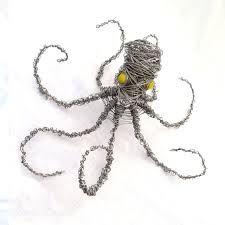 an octopus made out of wire and yellow beads