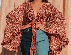 This Womens Blouses item by GardenbelleDesigns has 1776 favorites from Etsy shoppers. Ships from Mount Airy, MD. Listed on Jul 28, 2022 70s Style Tops Women, Boho Wrap Top, 70's Tops, 70s Tops Women, Bell Sleeve Top Outfit, Bell Sleeve Tie Top, Wrap Top Outfit, 70s Style Clothing, Bell Sleeve Wrap Top