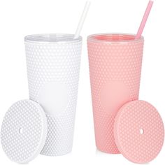 two plastic cups with lids and straws next to each other on a white background