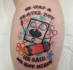 a tattoo on the leg of a person with an image of a cartoon character holding a skateboard