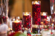 a table topped with lots of candles and christmas decorations