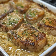 some meat and rice in a white dish