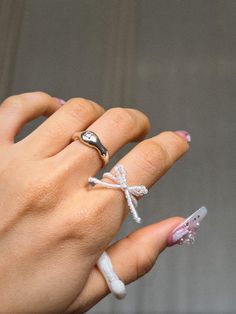 Handmade To Order.  🎀 Coquette aesthetic inspired beautifully crafted ribbon rings.  🎀 Various colours and styles available.  🎀 When handle with care when putting the rings on and off  as they are handmade and are delicate. Avoid contact with water and direct sunlight.  🎀 Made with high quality nylon wire & elastic, 2mm & 3mm seed & glass beads. NOTE: Only the Holographic beads are made with elastic wire. All the other styles are made with Nylon wire and does not stretch.  🎀All of our produ Coquette Rings, Rings Coquette, Coquette Ring, Korean Rings, Rings Korean, Rings Flower, Rings Gifts, Ribbon Ring, Flower Rings