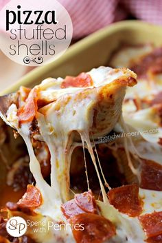 a slice of pizza is being lifted from a casserole dish with cheese and pepperoni