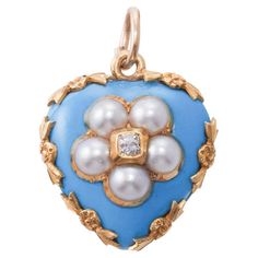 Wonderful representative of antique Victorian era Mourning jewelry, this delicate 14k gold heart pendant is set with bright turquoise blue enamel, pearls and an old mine cut diamond in the center, weighing approx. 0.05ct, The pendant has a hair locket in the back, typical for the time when it was crafted. The piece measures 7/8" x 6/8". Weighs 5.9 grams. Hair Locket, Enamel Locket, Aqua Glass, Heart Pendant Gold, Pierced Jewelry, Jewelry Blue, Bleu Turquoise, Sleeping Beauty Turquoise, Turquoise Green