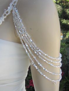 Handmade item Shoulder Necklace Bridal shoulder necklace 2 pieces per order. handcrafted beaded made to order Please get in touch for more information. Thank you so much for choosing my store. It is very importent to let my customers happy, so dont hesitate to contact me for your questions. Standart shipping I ship from Turkey , General delivery durations are USA : 12 /20 days Canada : 10/20days Australia: 15/25 days Bead Wedding Dress, Wedding Dress Straps, Pearl Applique, Strap Wedding Dress, Pearl Straps, Detachable Wedding Dress, Dress Embellishments, Wedding Anklets, Shoulder Jewelry