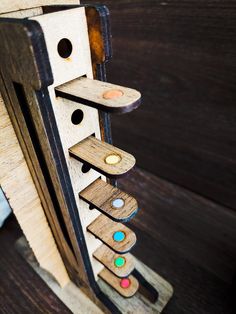 a close up of a piece of wood with buttons on it